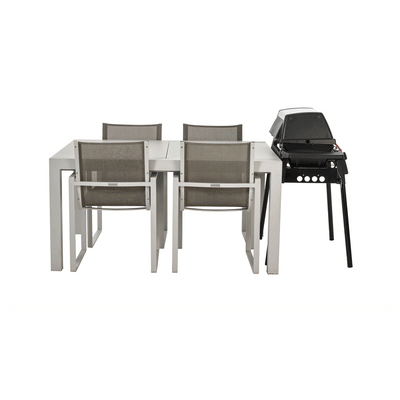 Furniture stacked together and enclosed with a BAG’IN cover to reduce space and protect from the elements.