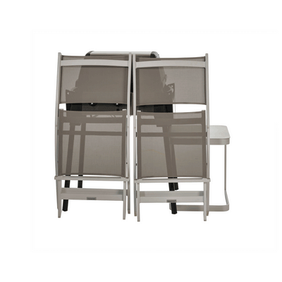 Outdoor grill and chairs stacked and protected under a BAG’IN weatherproof cover.
